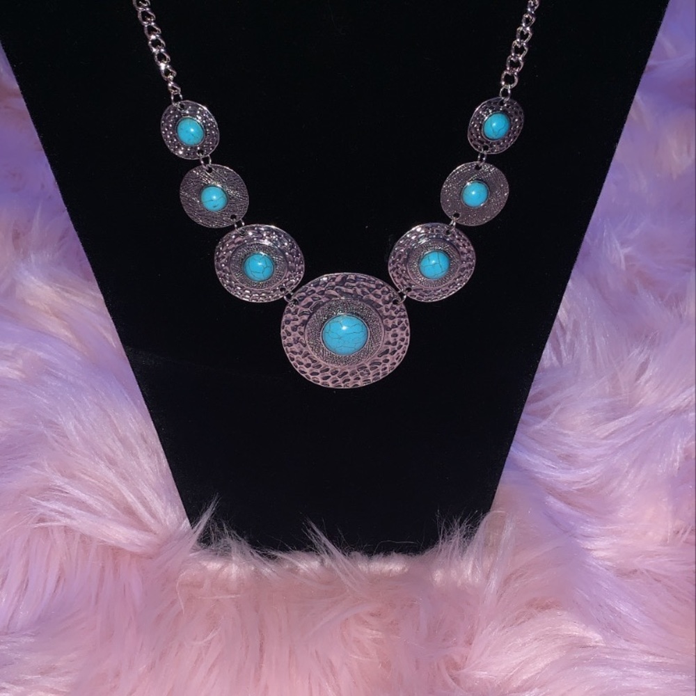 A pair of earrings and a necklace